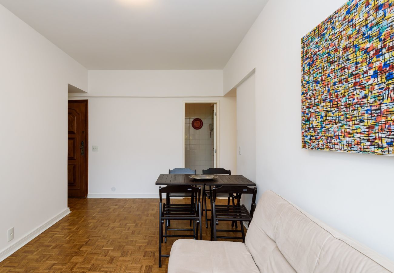 Living room with dining table and sofa.