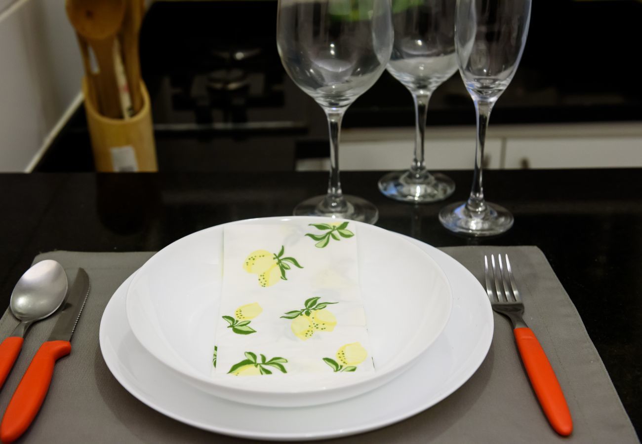 Cutlery, plate and glasses.