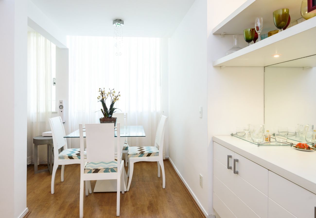 Dining room with table for meals.